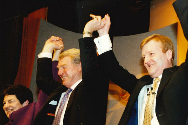 A photo of Paddy Ashdown and Charles Kennedy linking raised hands.