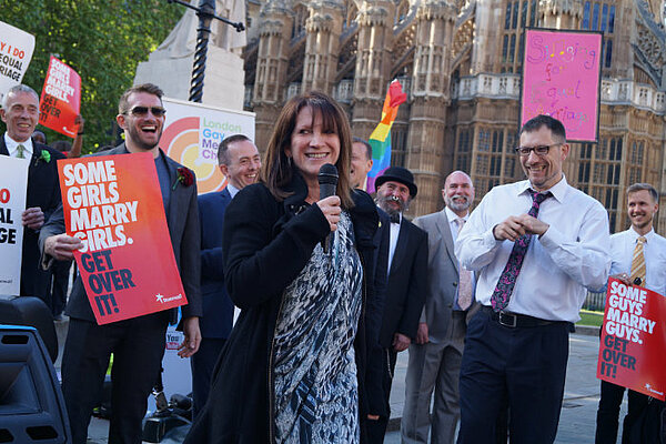 A photo of Lynn Featherstone celebrating the passage of the Marriage (Same-Sex Couples) Act