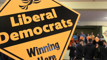 A poster with the bird of liberty, 'Liberal Democrats' and 'Winning Here'
